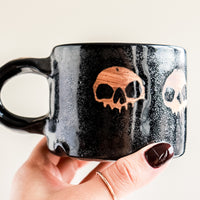 Black Five Skulls Mug